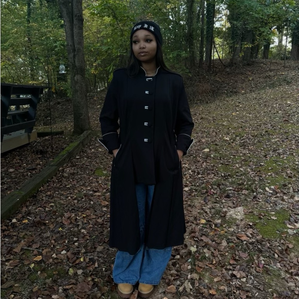 Black and white coat with an open bottom